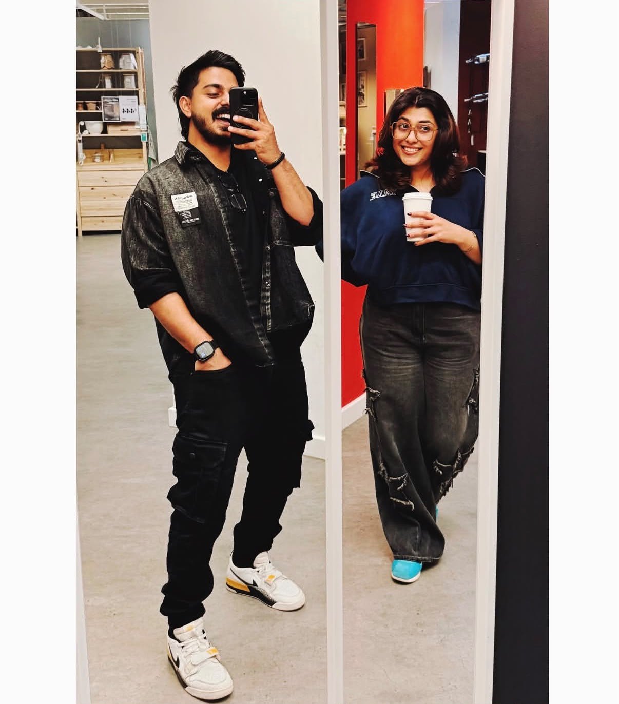 The couple taking a mirror photo